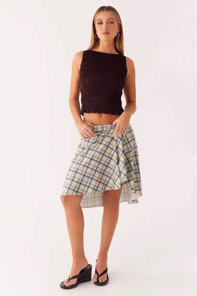 Detail of the plaid asymmetric midi skirt