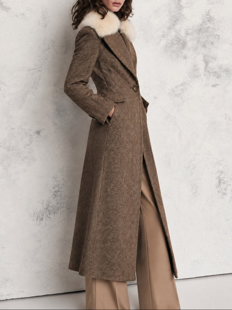 Close-up texture of the herringbone wool blend long coat with faux fur collar