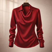 Woman wearing the isola draped satin blouse