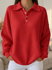 Back view of the women's textured knit polo sweater oversized