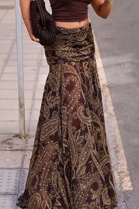 Woman wearing the boho brown paisley print maxi skirt