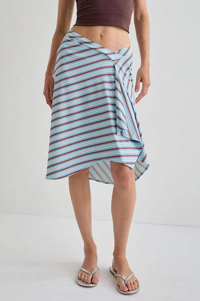 Close-up of the plaid asymmetric midi skirt