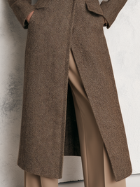 Sleeve and cuff detail on the herringbone wool blend long coat with faux fur collar