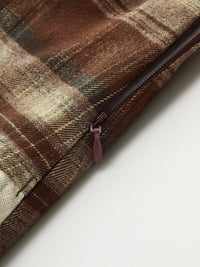 Back view of the plaid asymmetric pleated mini skirt
