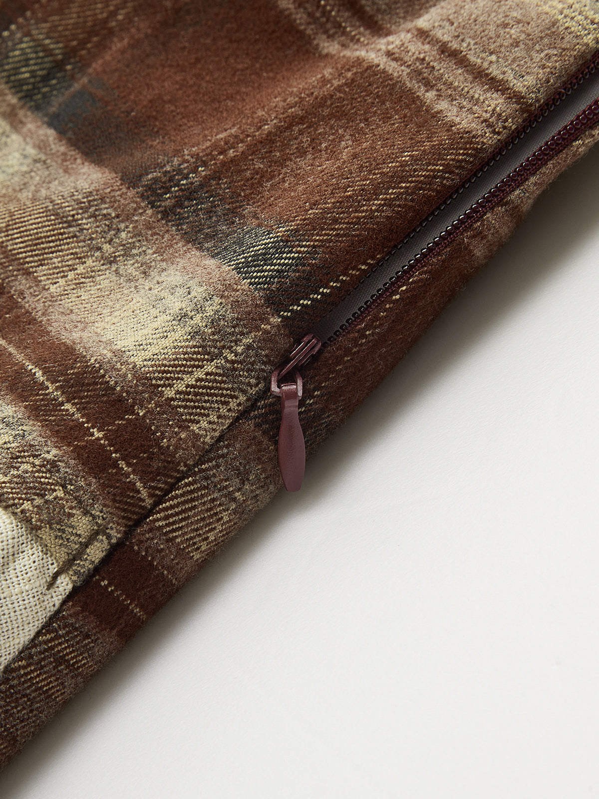 Back view of the plaid asymmetric pleated mini skirt