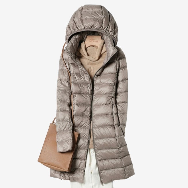 Woman wearing the claudette hooded longline puffer coat