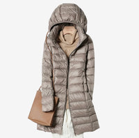 Woman wearing the claudette hooded longline puffer coat