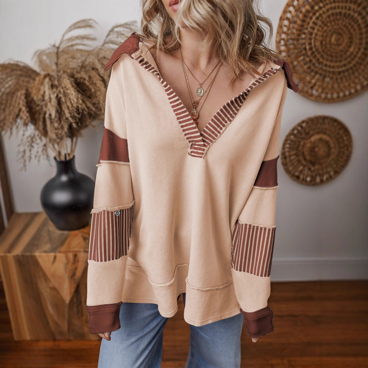 Front view of the oversized v-neck striped sweatshirt