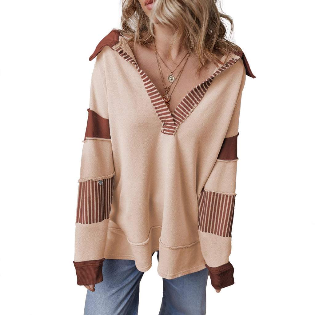 Woman wearing the oversized v-neck striped sweatshirt