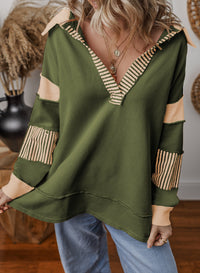 Styled look with the oversized v-neck striped sweatshirt