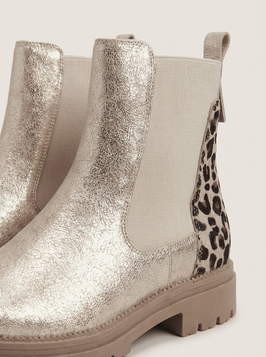 Detail of the brynn | gold chelsea boots with leopard heel