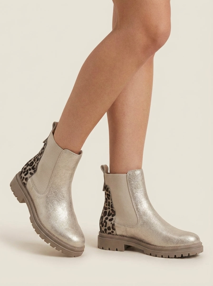Front view of the brynn | gold chelsea boots with leopard heel