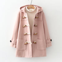 Woman wearing the woolen hoodie coat