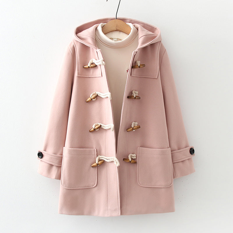 Woman wearing the woolen hoodie coat