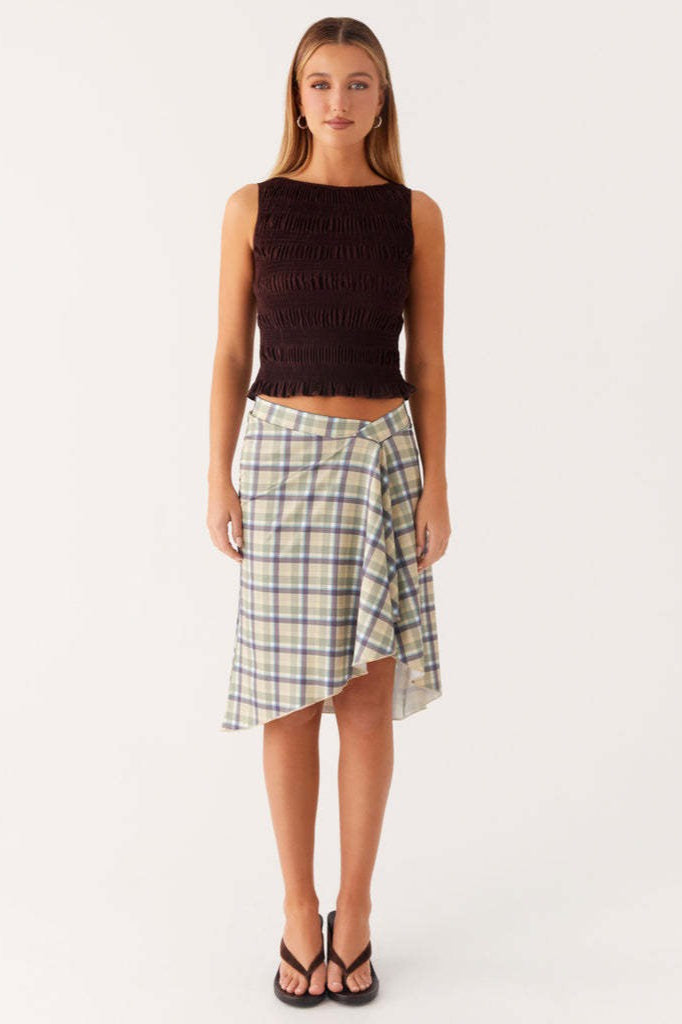Styled look with the plaid asymmetric midi skirt