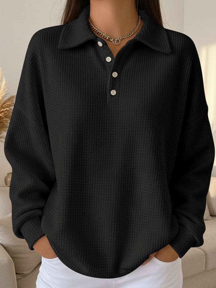 Hemline detail of the women's textured knit polo sweater oversized