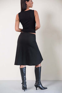Detail of the plaid asymmetric midi skirt