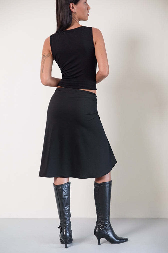 Detail of the plaid asymmetric midi skirt