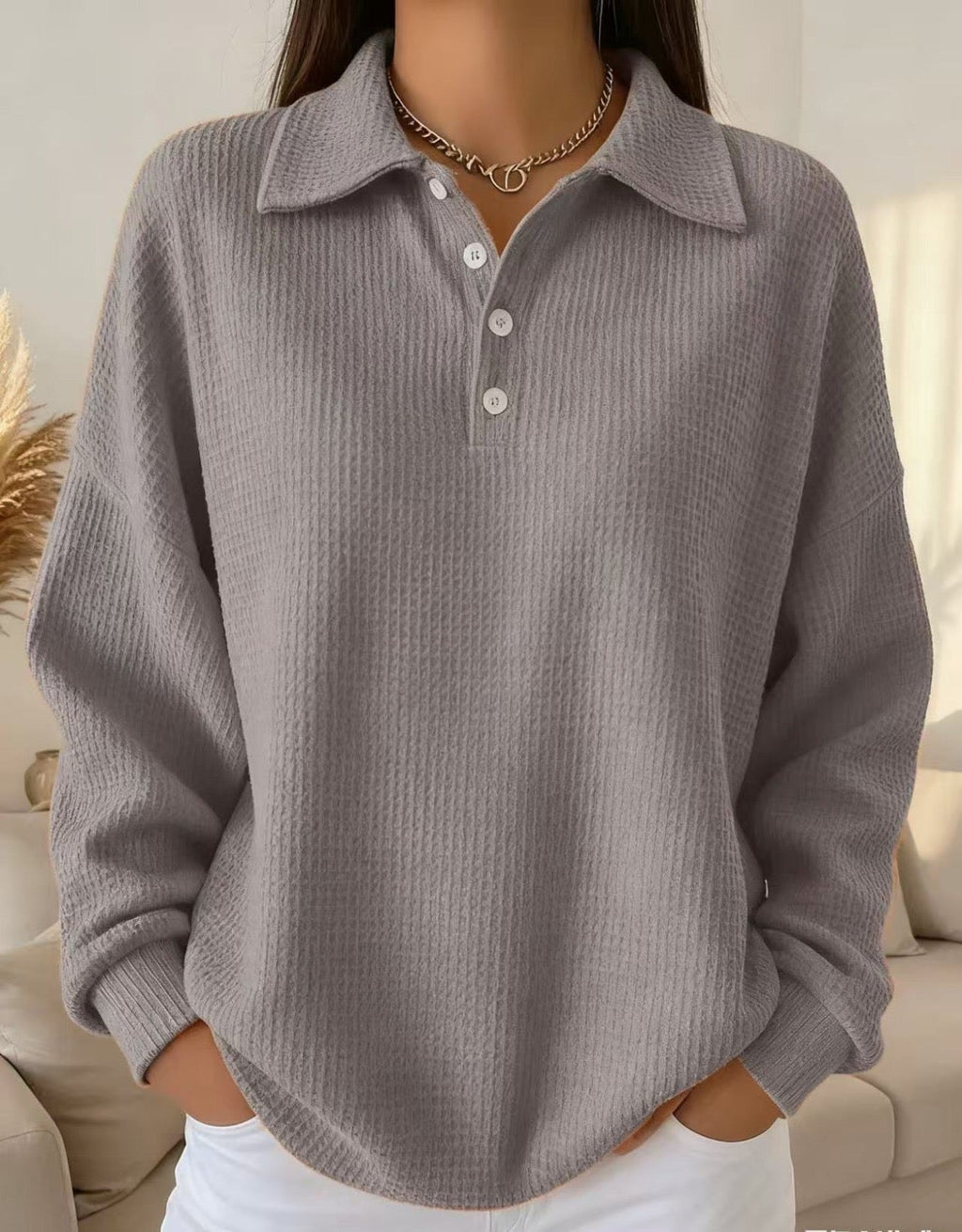 Sleeve and cuff detail on the women's textured knit polo sweater oversized