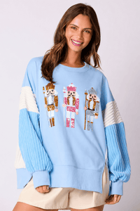 Woman wearing the sequin toy soldier crew neck sweatshirt