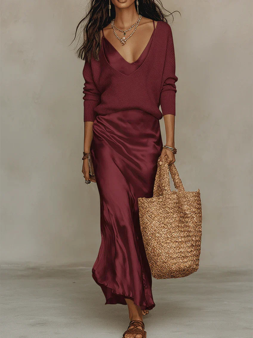 Woman wearing the elena satin midi dress with matching sweater