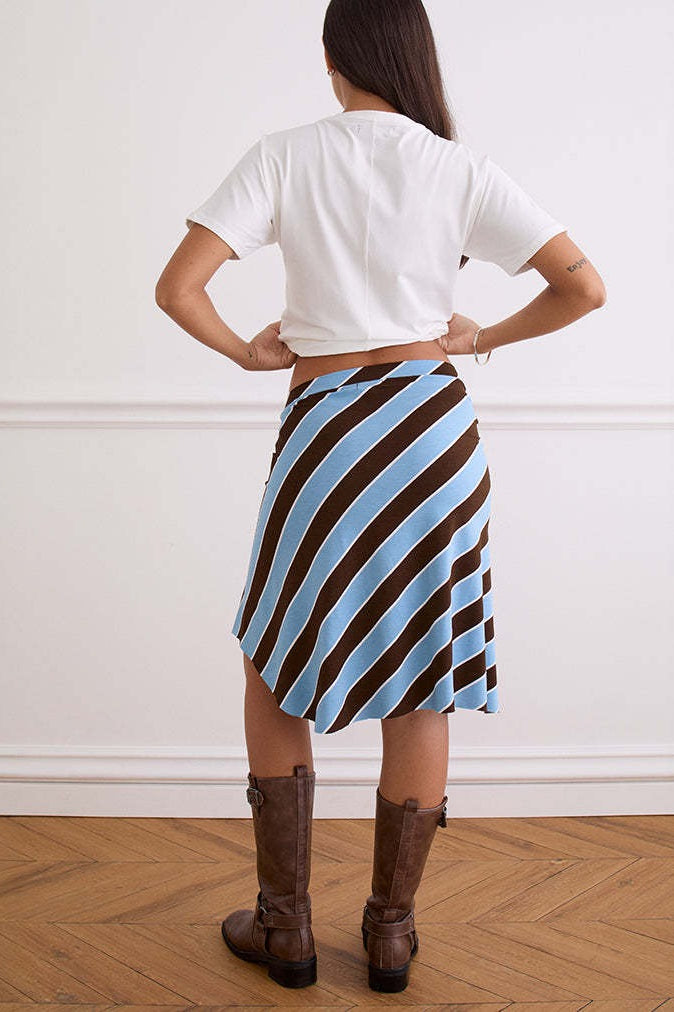 Detail of the plaid asymmetric midi skirt