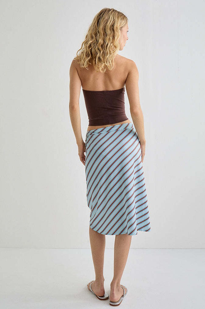 Woman wearing the plaid asymmetric midi skirt