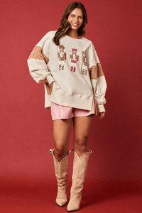 Hemline detail of the sequin toy soldier crew neck sweatshirt