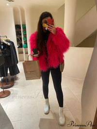Woman wearing the fur elegant fringe coat