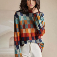 Woman wearing the patchwork check turtleneck sweater with white trousers