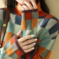 Patchwork check turtleneck sweater styled with a shoulder bag