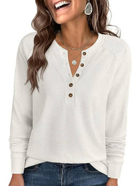 Woman wearing the zadie waffle knit henley top