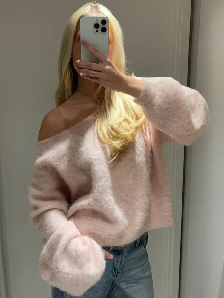 Woman wearing the selene off-shoulder knit sweater