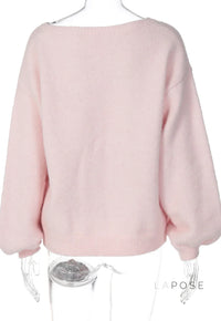 Back view of the selene off-shoulder knit sweater