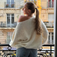 Back view of the selene off-shoulder knit sweater