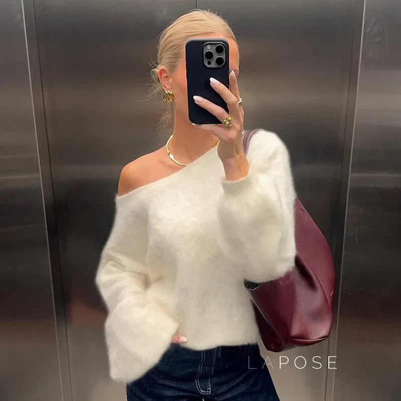 Woman wearing the selene off-shoulder knit sweater