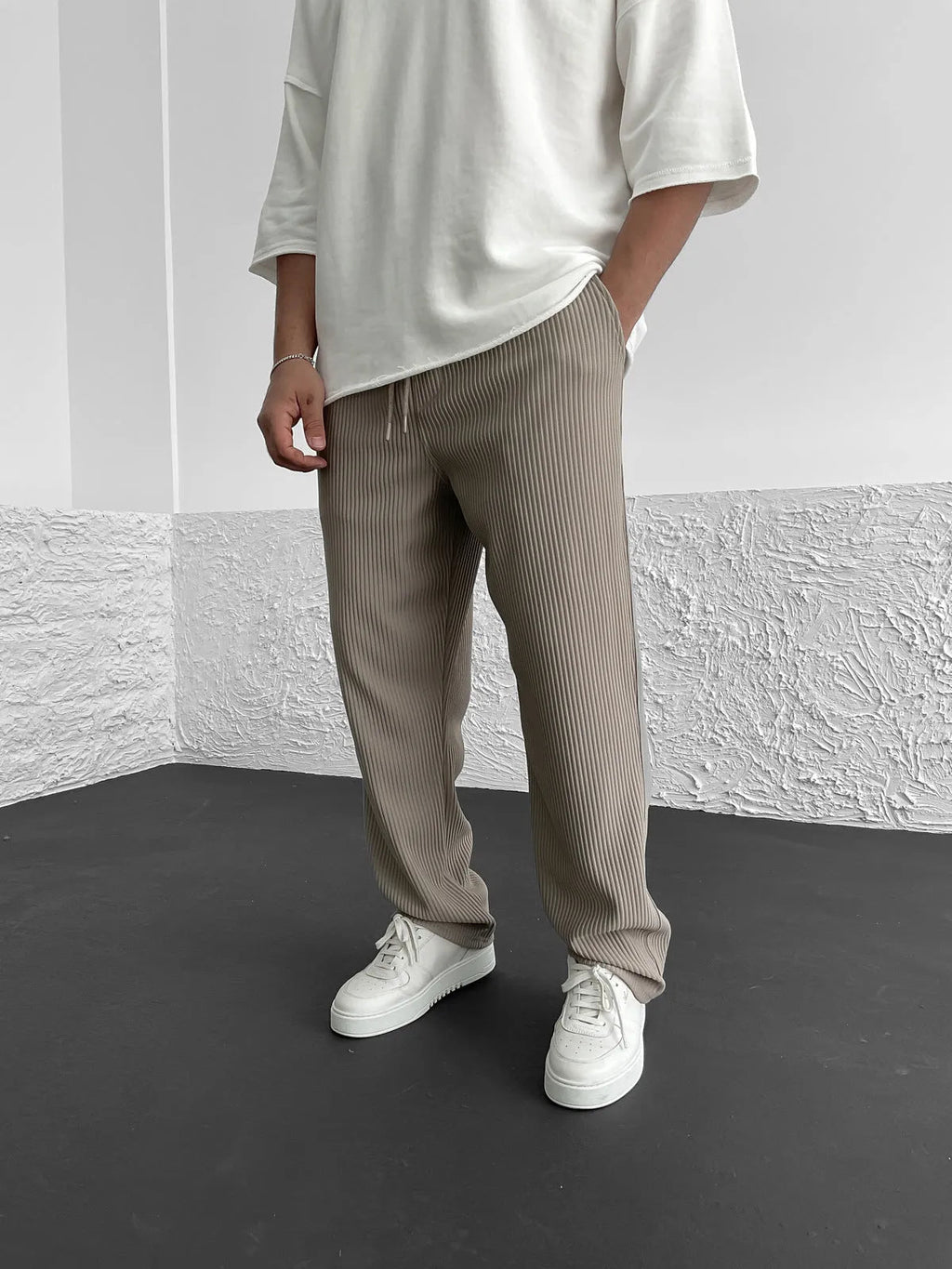 Woman wearing the relaxed heavyweight knit wide-leg pants | baggy stretch-waist fit