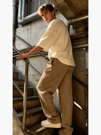 Detail of the relaxed heavyweight knit wide-leg pants | baggy stretch-waist fit