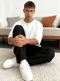 Sleeve and cuff detail on the relaxed heavyweight knit wide-leg pants | baggy stretch-waist fit