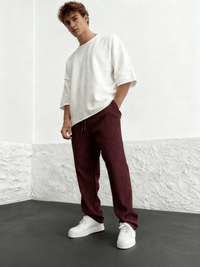 Side profile of the relaxed heavyweight knit wide-leg pants | baggy stretch-waist fit