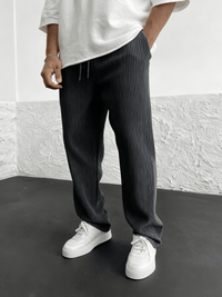 Detail of the relaxed heavyweight knit wide-leg pants | baggy stretch-waist fit