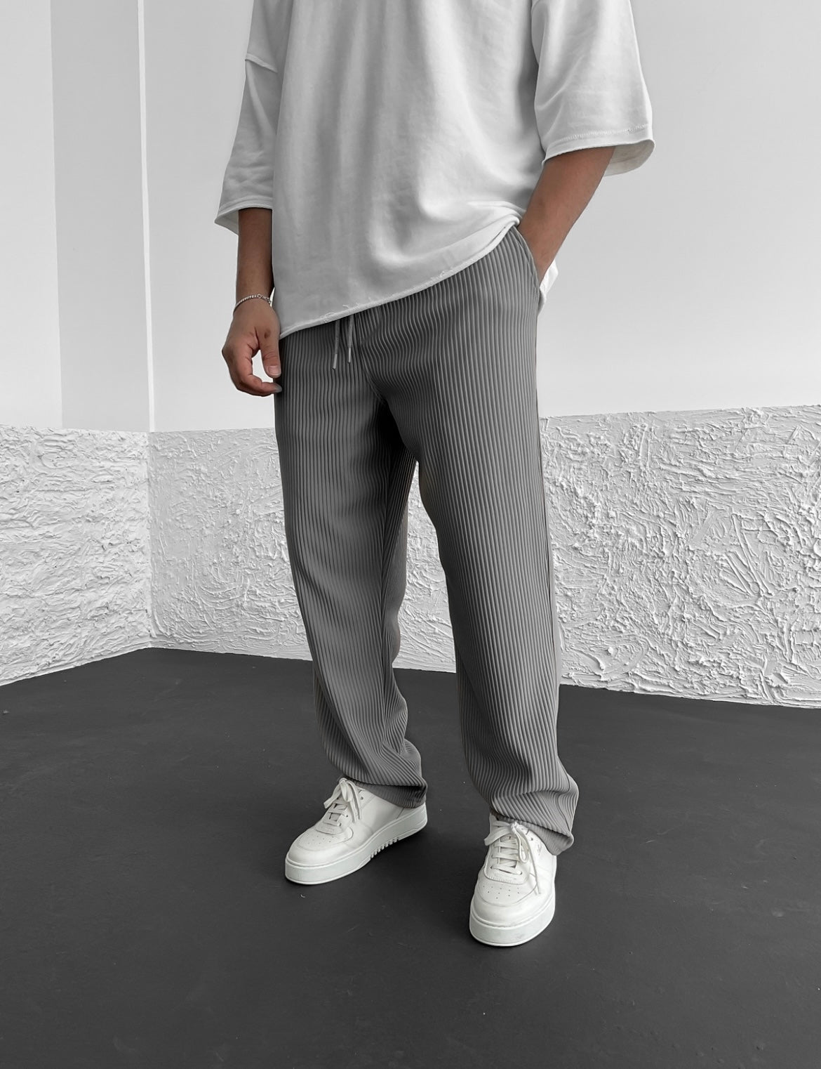 Sleeve and cuff detail on the relaxed heavyweight knit wide-leg pants | baggy stretch-waist fit