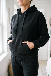 Black fleece hoodie and jogger set styled on Cape Cod for women 50+ – Susan & Anne