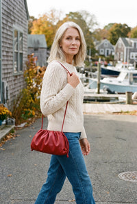 Red dumpling hobo bag styled on Cape Cod for women 50+ – Susan & Anne