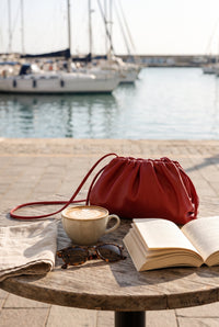 Red dumpling hobo bag styled on Cape Cod for women 50+ – Susan & Anne