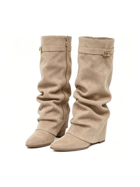Woman wearing the slouchy fold-over lock knee-high boots in beige