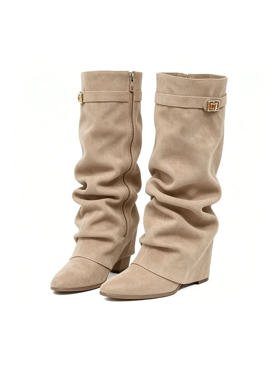 Woman wearing the slouchy fold-over lock knee-high boots in beige