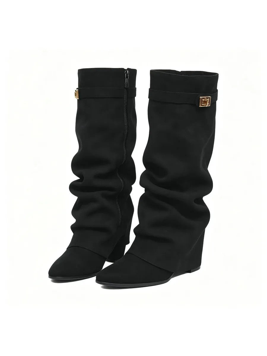 Woman wearing the slouchy fold-over lock knee-high boots in black